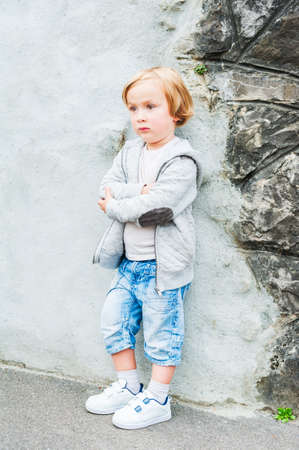 Outdoor portrait of a cute toddler boyの写真素材