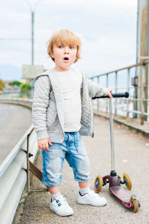 Outdoor portrait of a cute toddler boyの写真素材