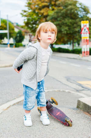 Outdoor portrait of a cute toddler boyの写真素材