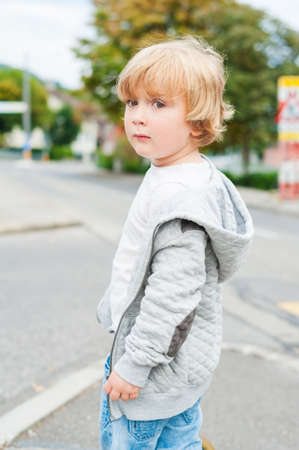 Outdoor portrait of a cute toddler boyの写真素材