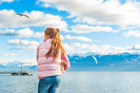 Outdoor portrait of adorable little girl, back viewの写真素材