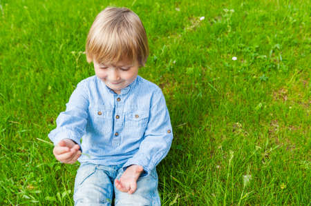 Outdoor portrait of a cute toddler boy