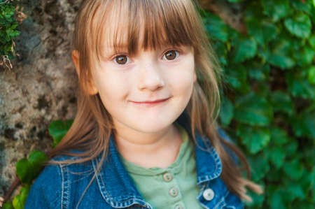 Portrait of a cute little girl outdoors