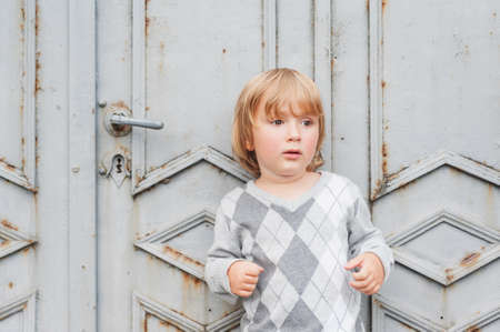 Outdoor portrait of a cute toddler boyの写真素材