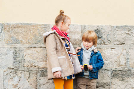 Fashion portrait of adorable kids outdoorsの写真素材
