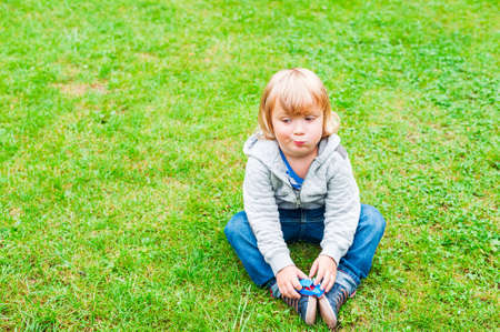 Outdoor portrait of adorable toddler boyの写真素材
