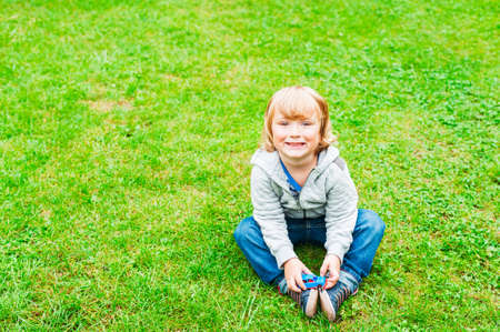 Outdoor portrait of adorable toddler boyの写真素材