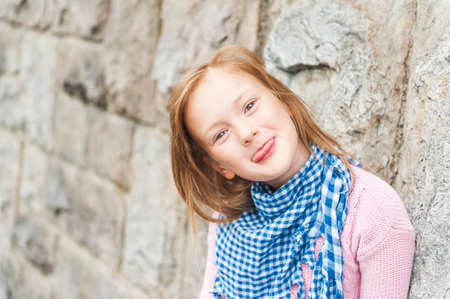 Outdoor portrait of adorable little girl