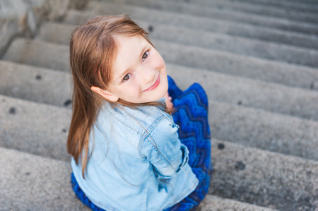 Portrait of a cute little girl, foreshortening portrait, face upの写真素材