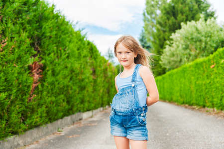 Summer portrait of a cute little girl of seven years oldの写真素材