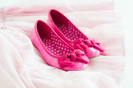 Pink ballerina shoes on tutu skirtの写真素材