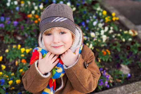 Outdoor portrait of a cute little boy on a nice cold dayの写真素材