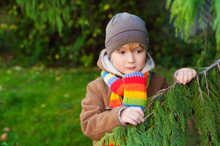 Outdoor portrait of a cute little boy on a nice cold dayの写真素材