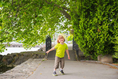 Portrait of a cute little boy having fun outdoorsの写真素材