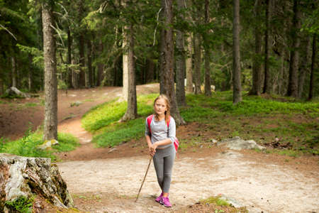 Little hiker girl in forest. Photo from Champex-Lac, Valais, swiss Alpsの写真素材