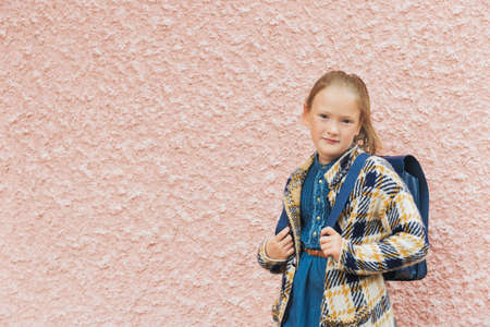 Portrait of a little girl with backpackの写真素材