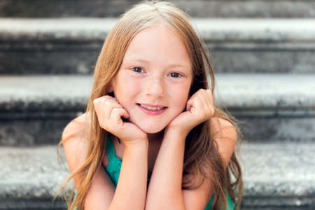 Close up portrait of a cute little girl of 7-8 years oldの写真素材