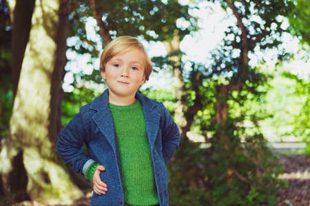 Outdoor portrait of a cute little boy of 4 years old, toned imageの写真素材