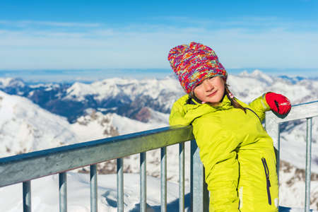 Little girl having fun during winter vacation in mountains, swiss Alpsの写真素材