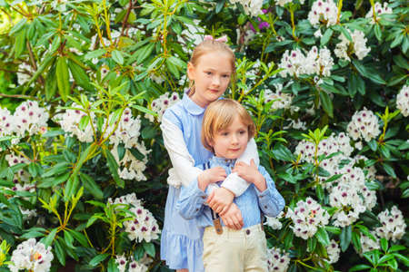Outdoor portrait of adorable kids, vintage styleの写真素材