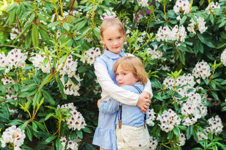 Outdoor portrait of adorable kids, vintage styleの写真素材