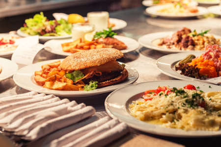 Food orders on the kitchen table in the restaurant