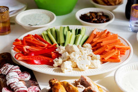 Party table with fresh vegetablesの写真素材