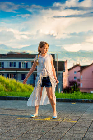 Fashion portrait of a cute little girl of 8-9 years oldの写真素材