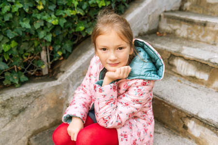 Outdoor portrait of a cute little girl of 8 years oldの写真素材