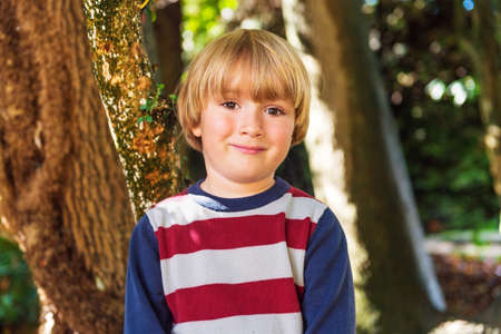 Outdoor portrait of a cute little boyの写真素材