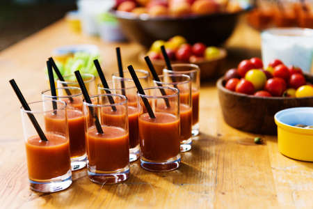 Authentic appetizers on rustic  table, gazpacho, fresh hand picked tomatoes, countryside dinner, party timeの写真素材
