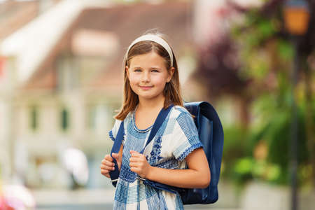 Pretty little 9 year old girl walking back to schoolの写真素材