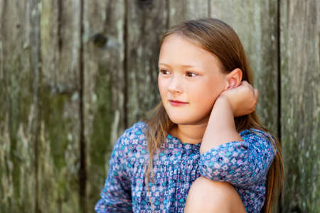 Close up portrait of a cute little girl of 8-9 years oldの写真素材