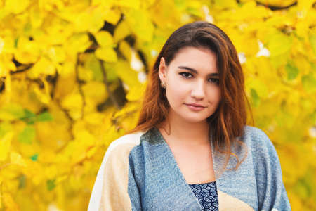 Autumn portrait of young and beautiful mixed race Asian Caucasian womanの写真素材