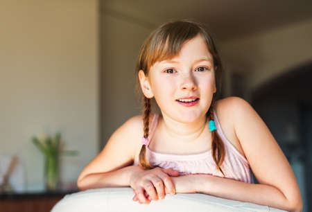 Close up portrait of a cute little girl of 9-10 year oldの写真素材