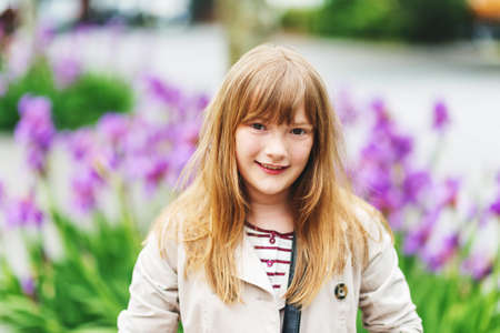 Outdoor portrait of pretty little girl with stylish haircutの写真素材