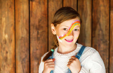 Close up portrait of adorable little kid girl with birthday party face paintingの写真素材