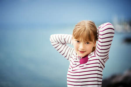 Outdoor close up portrait of young 8-9 year old girlの写真素材