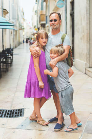 Portrait of happy family enjoying summer vacation in Europeの写真素材