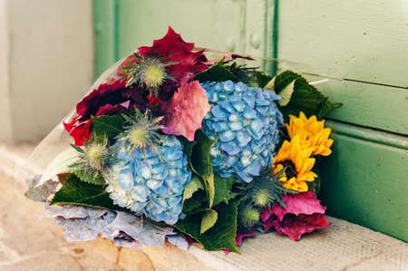 Autumn bouquet of sunflowers and blue hydrangeaの写真素材
