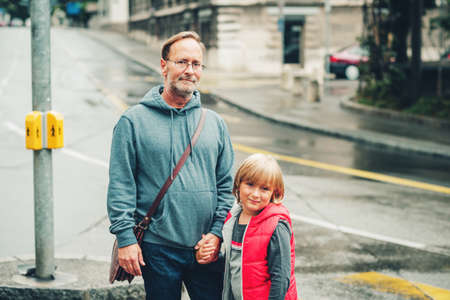 Outdoor portrait of happy father and little son の写真素材