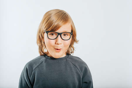 Studio shot of cute little boy wearing eyeglassesの写真素材
