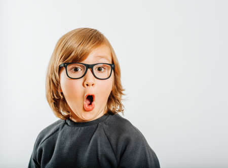 Studio shot of cute little boy wearing eyeglassesの写真素材
