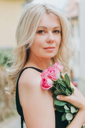 Outdoor portrait of beautiful blond woman, close up, beauty conceptの写真素材