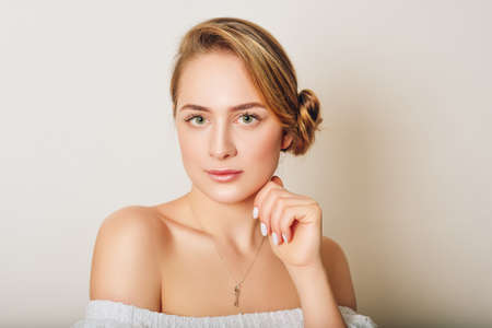Young beautiful woman studio shot, pretty girl with professional make up 