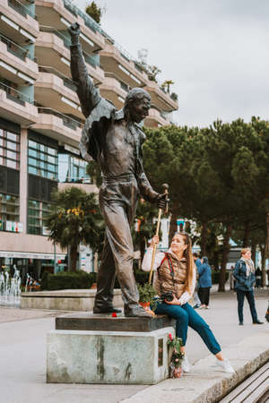 MONTREUX, SWITZERLAND - MAY 10 , 2018. Young woman tourist visiting the statue of legendary singer Freddie Mercuryのeditorial素材