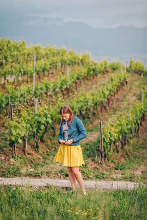 Outdoor portrait of pretty teen girl, hiking in Lavaux vineyards, Switzerlandの写真素材