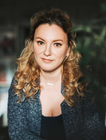 Close up portrait of 35-40 year old woman with blond hair