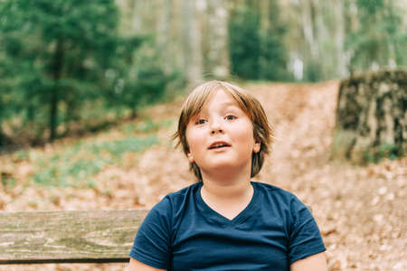 Cute little boy enjoying fresh summer forestの写真素材