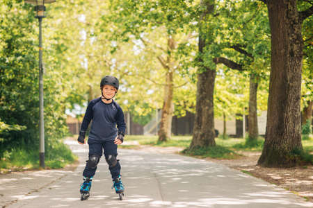 Active little boy skating in summer park, healthy lifestyle for childrenの写真素材